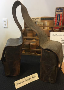 Medicine saddle bags with other pharmacy artifacts.