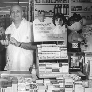 Richard Bogard behind the counter of his pharmacy.